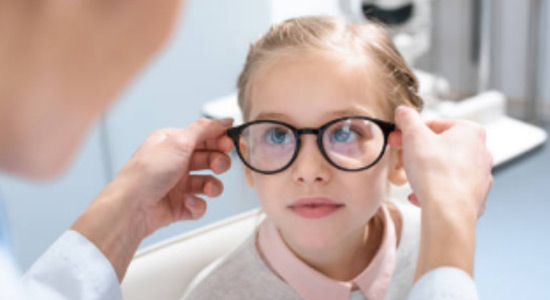 A child being fit with specialty eye glasses by our optometrist in Hamilton.